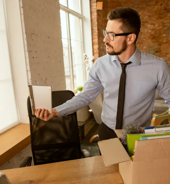 Woman leaning on cardboard boxes