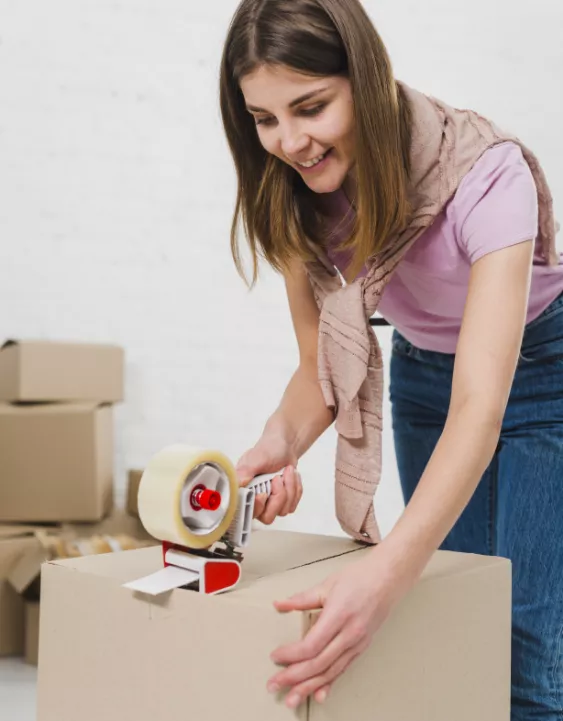 Girl taping a cardboard box